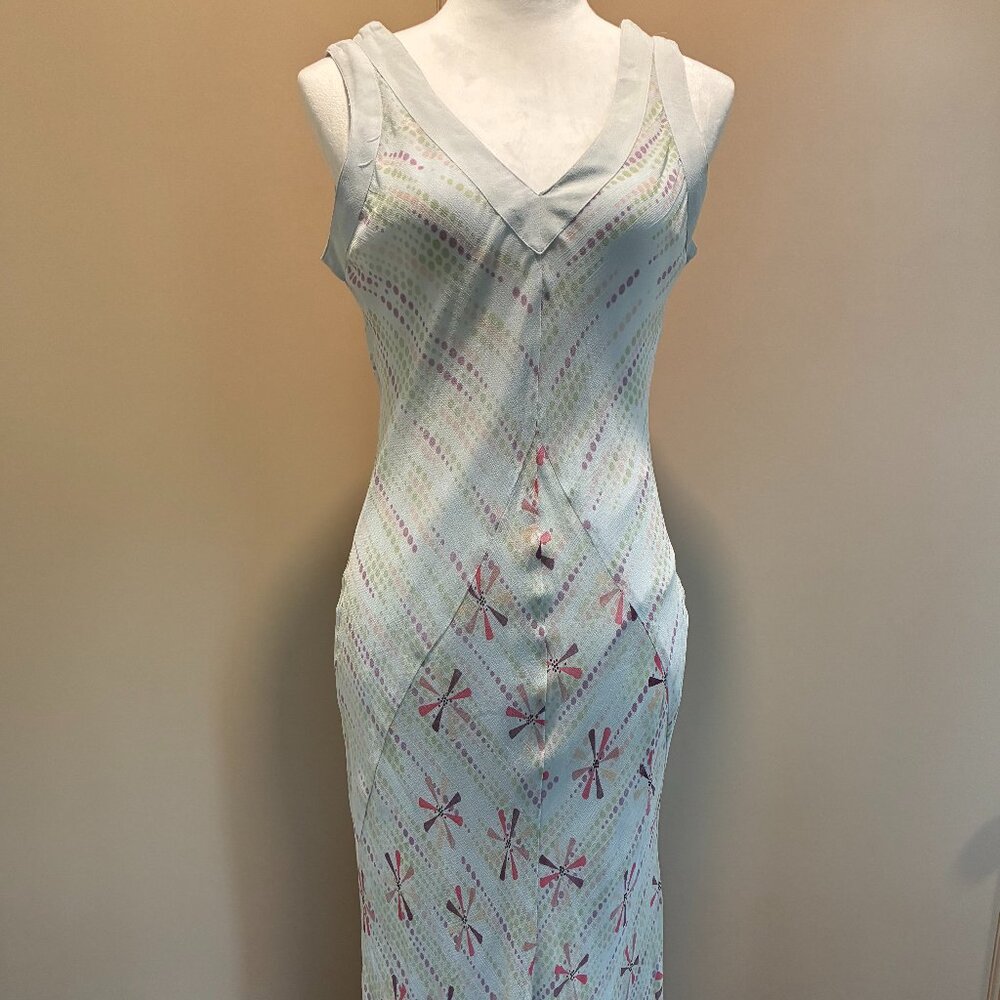 Elegant pale blue, V-neck, long sleeveless dress.
